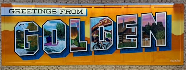 A 'Greetings from Golden' postcard-style mural in downtown Golden, Colorado