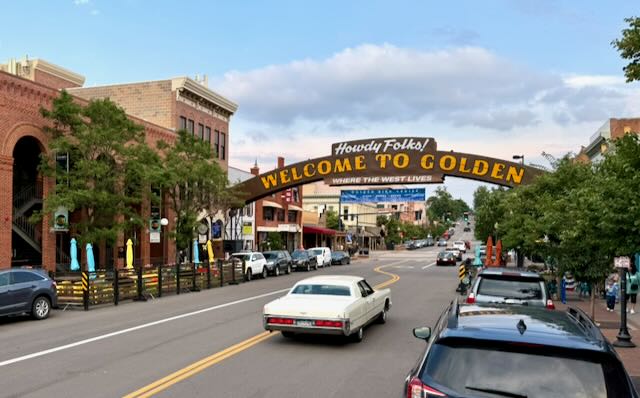 The 'Howdy Folks! Welcome to Golden — Where the West Lives' arch over Washington Avenue in downtown Golden